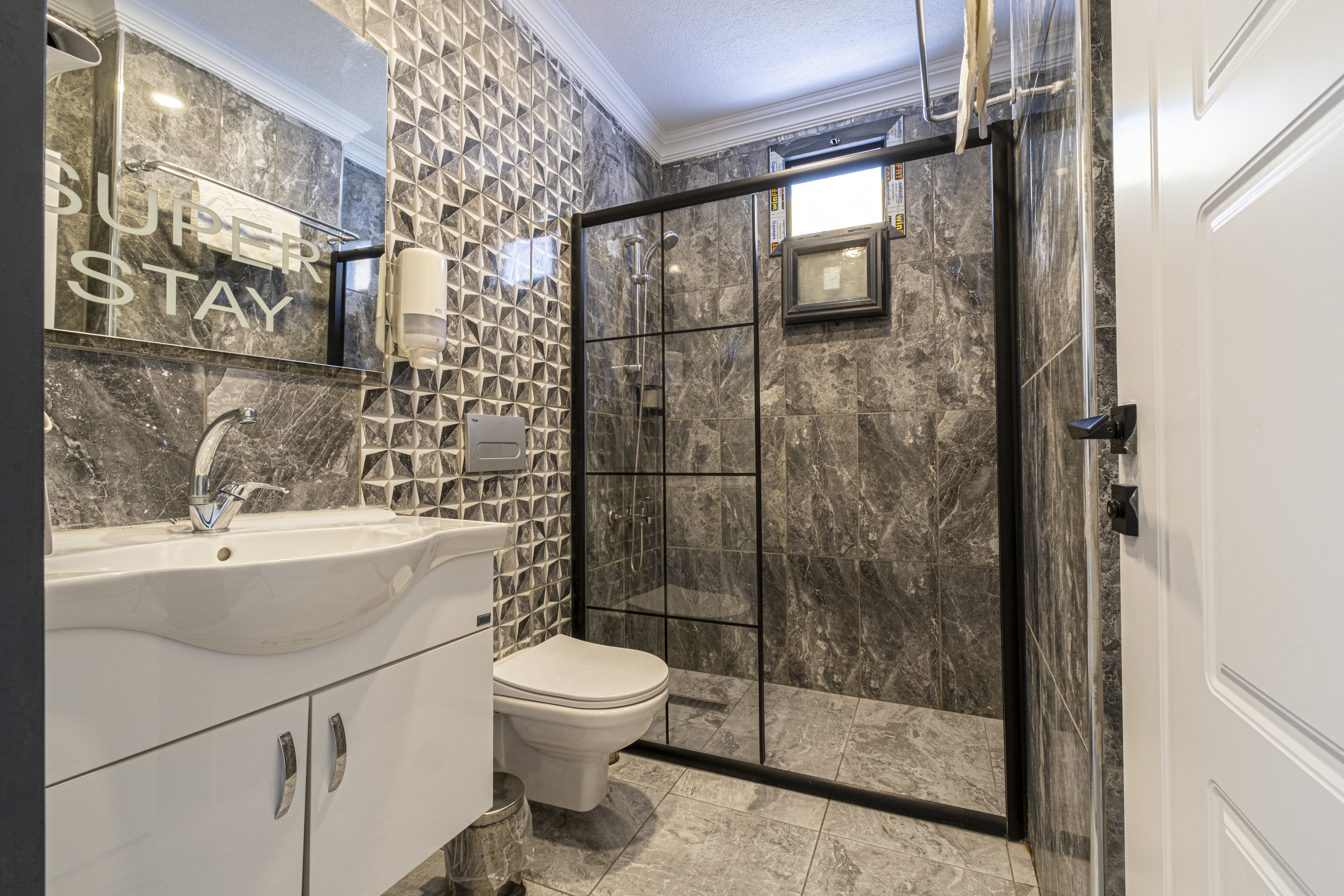 Outdoor swimming pool with sunbeds