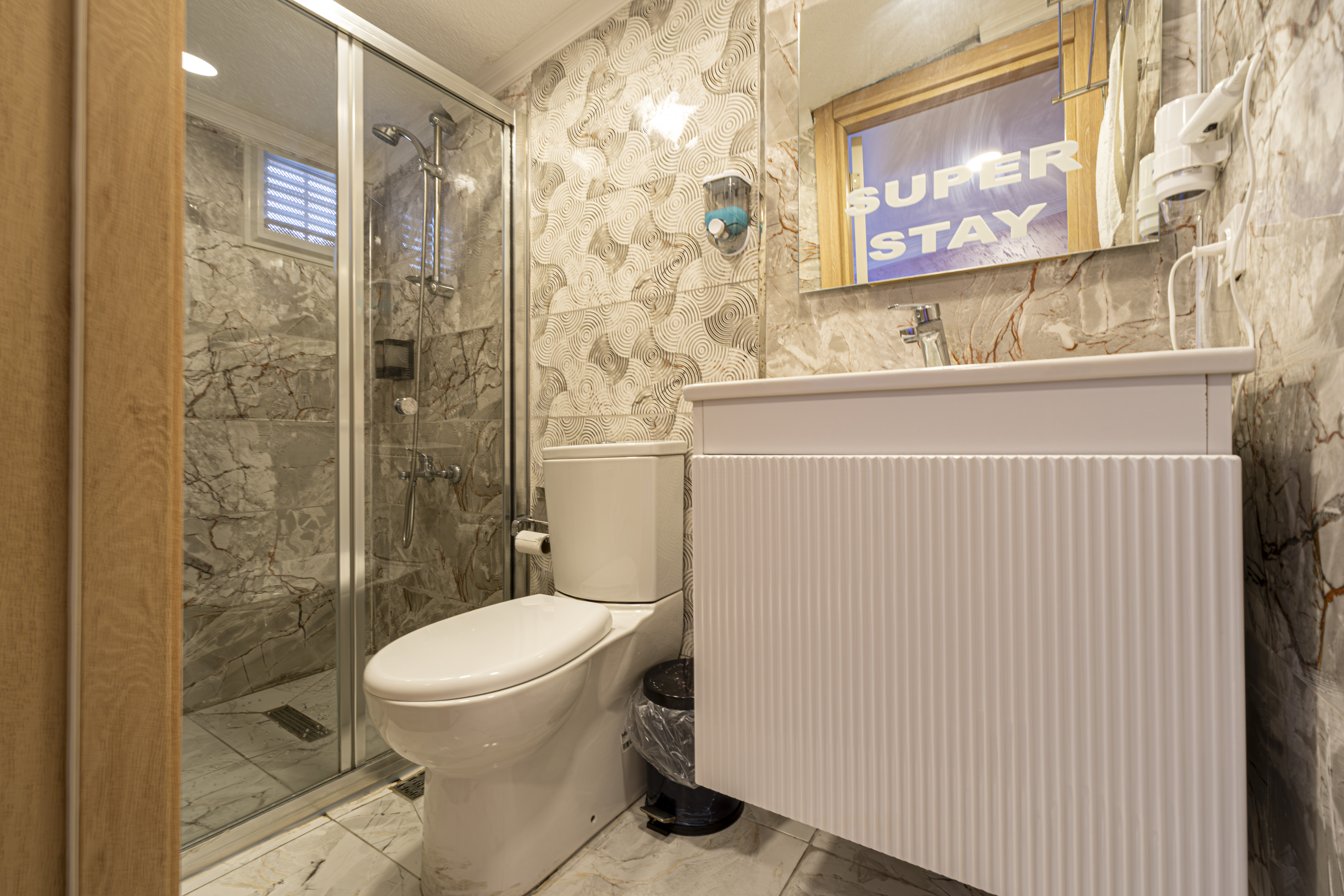 Outdoor swimming pool with sunbeds