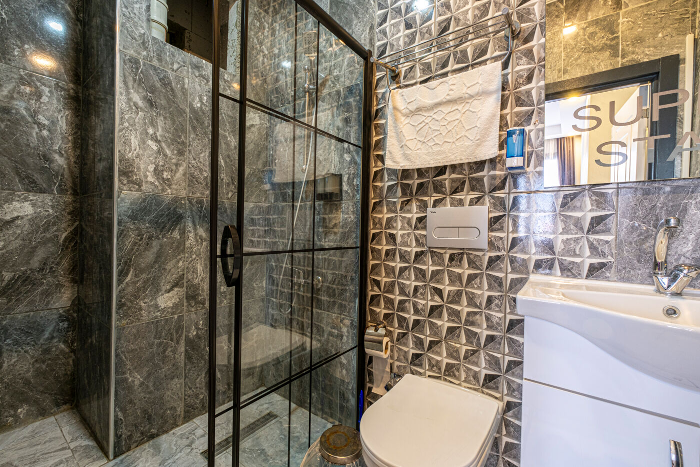 Outdoor swimming pool with sunbeds