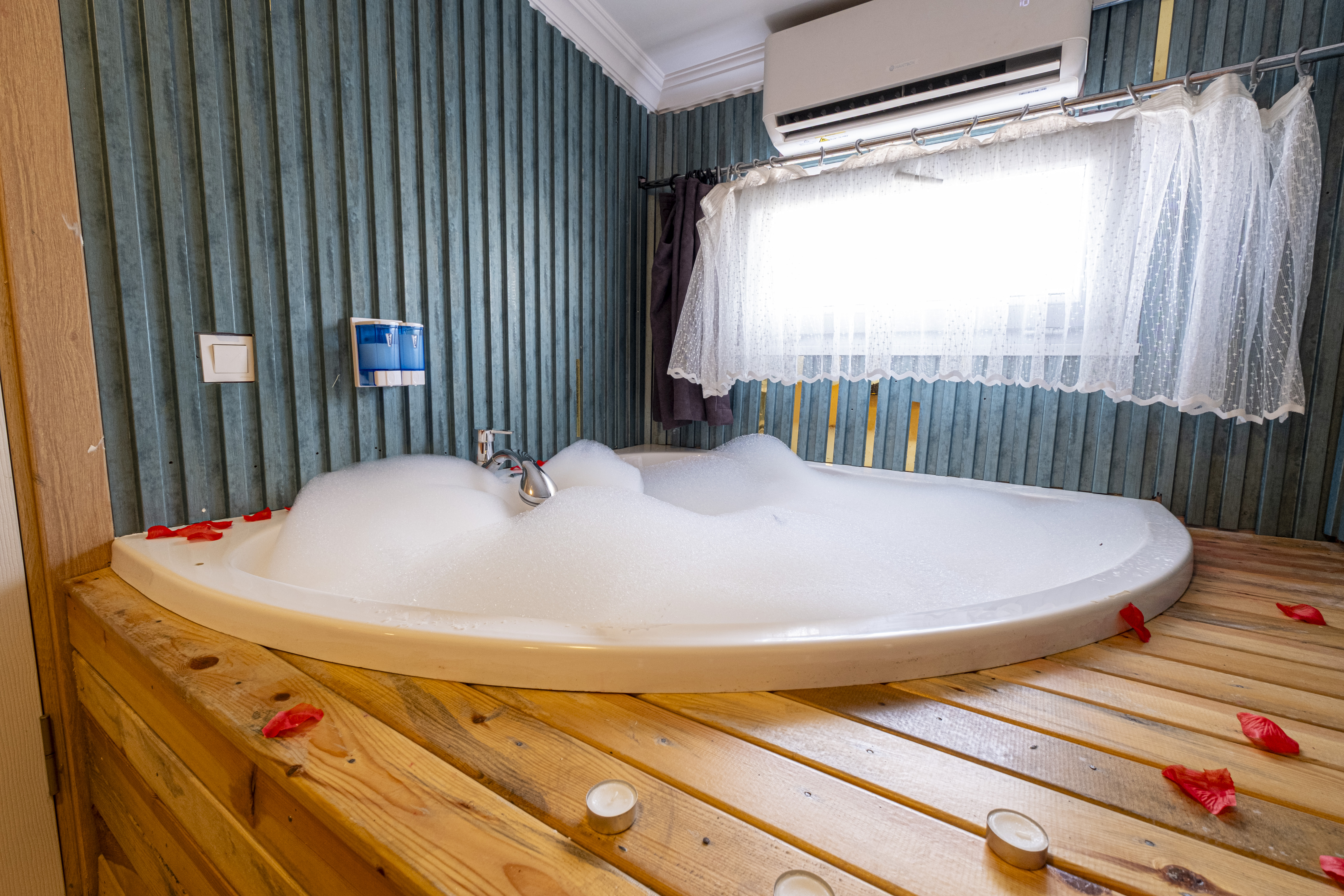 Experience ultimate relaxation at a sunlit tropical poolside resort featuring palm trees and blue skies.