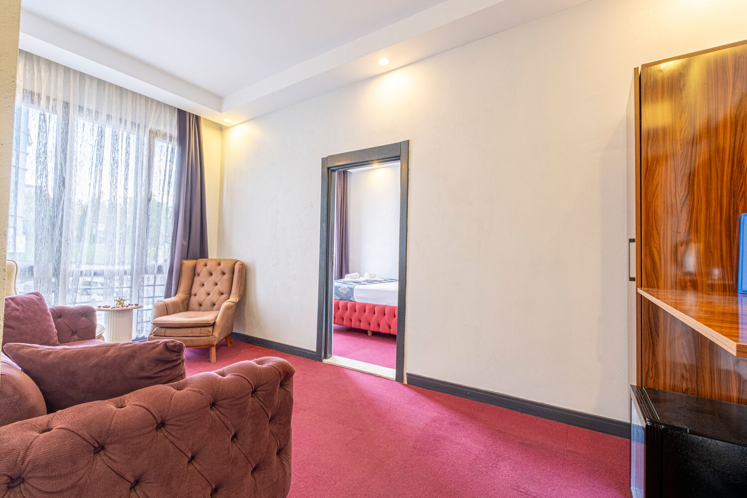 Experience ultimate relaxation at a sunlit tropical poolside resort featuring palm trees and blue skies.