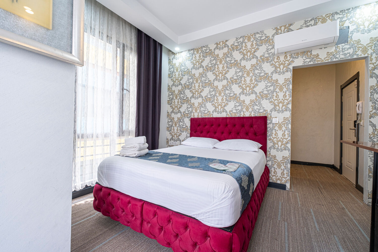 Experience ultimate relaxation at a sunlit tropical poolside resort featuring palm trees and blue skies.